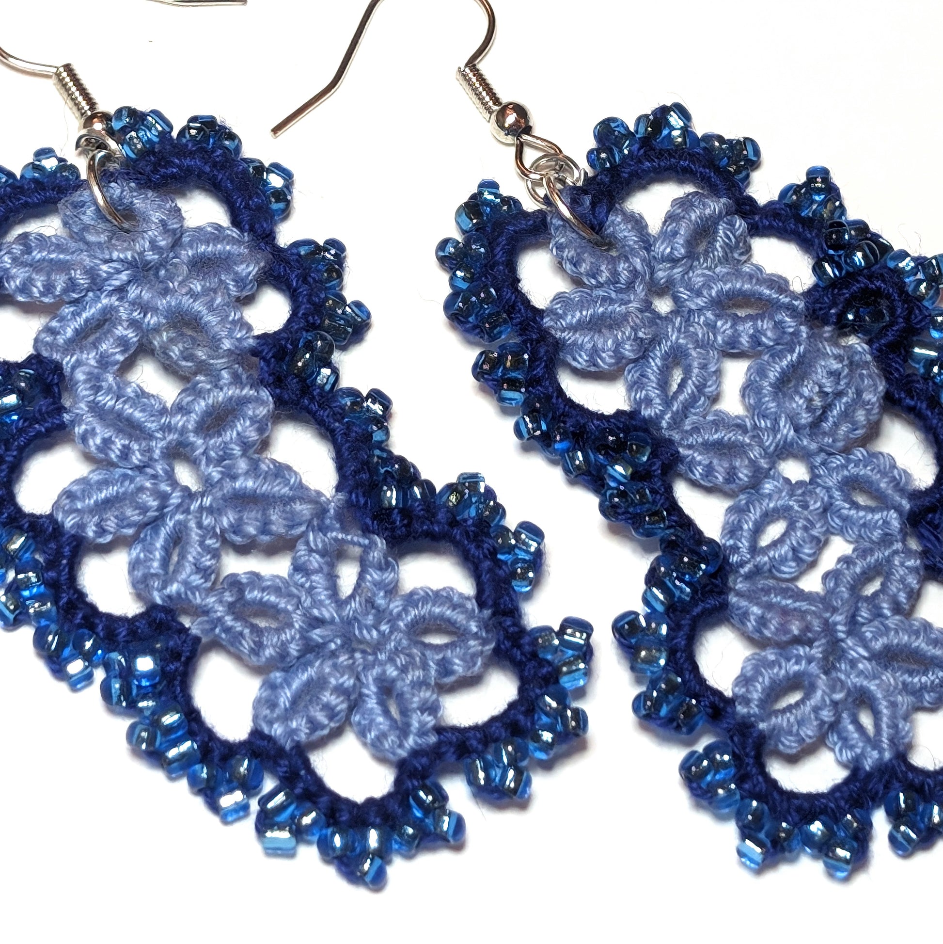3 Blues Jellybean Earrings Closeup on white background