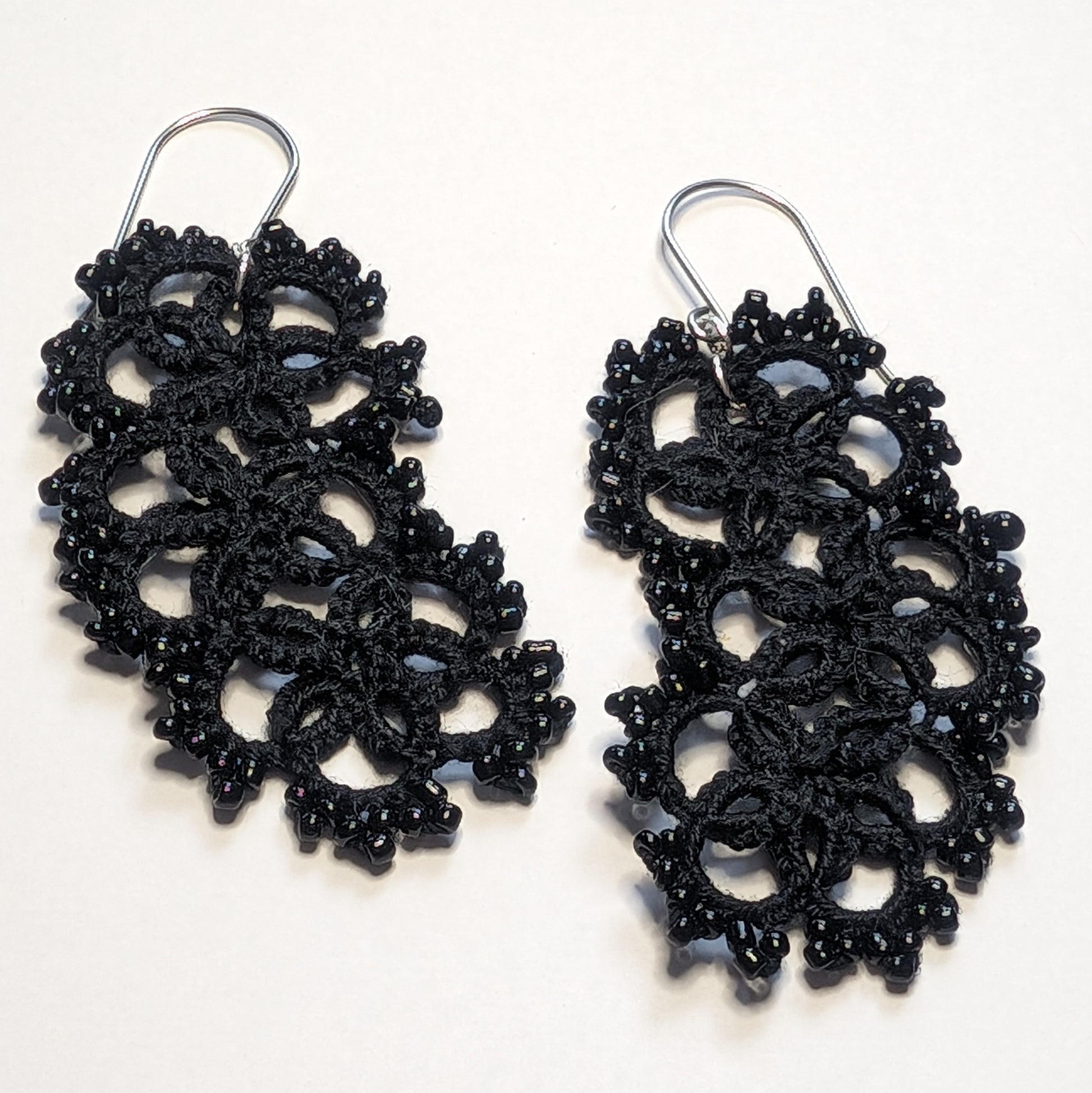 All Black Jellybean Earrings on White Background