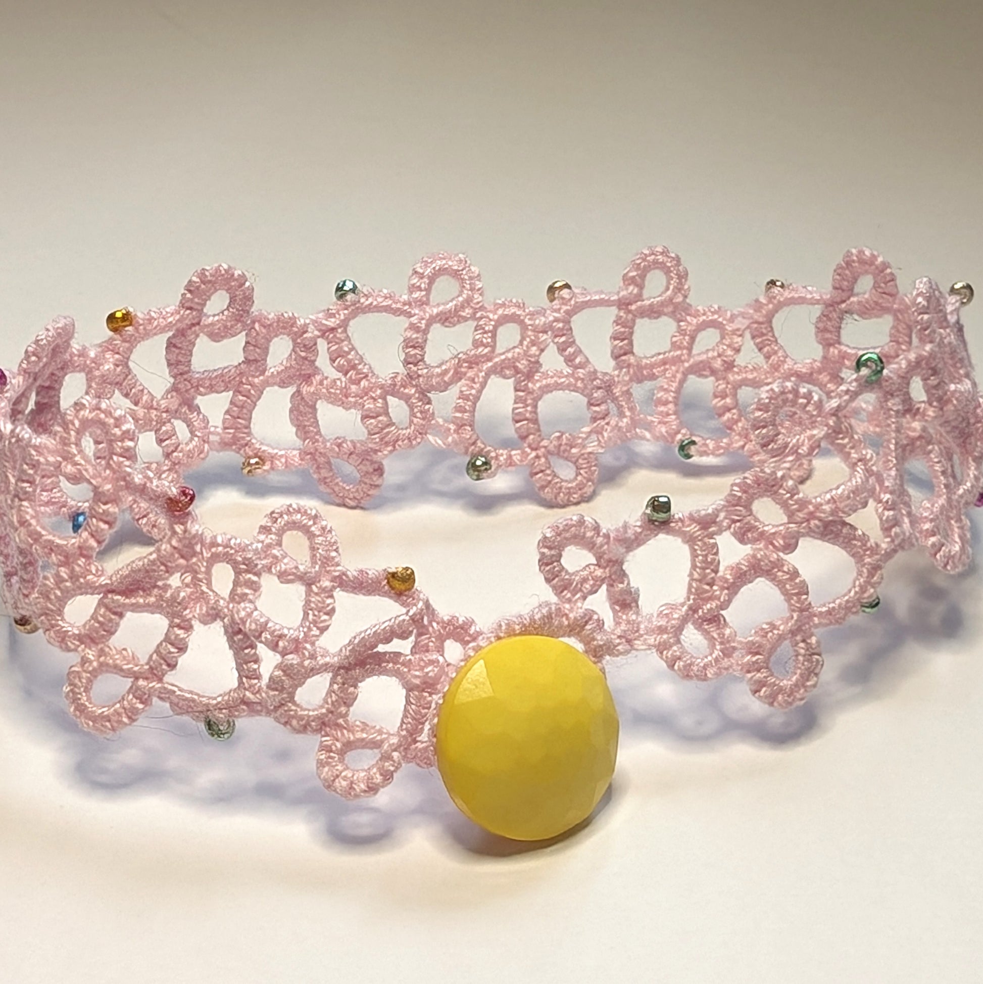 Baby Pink Multi Color Yellow Button Modern Filigree Bracelet on White Background