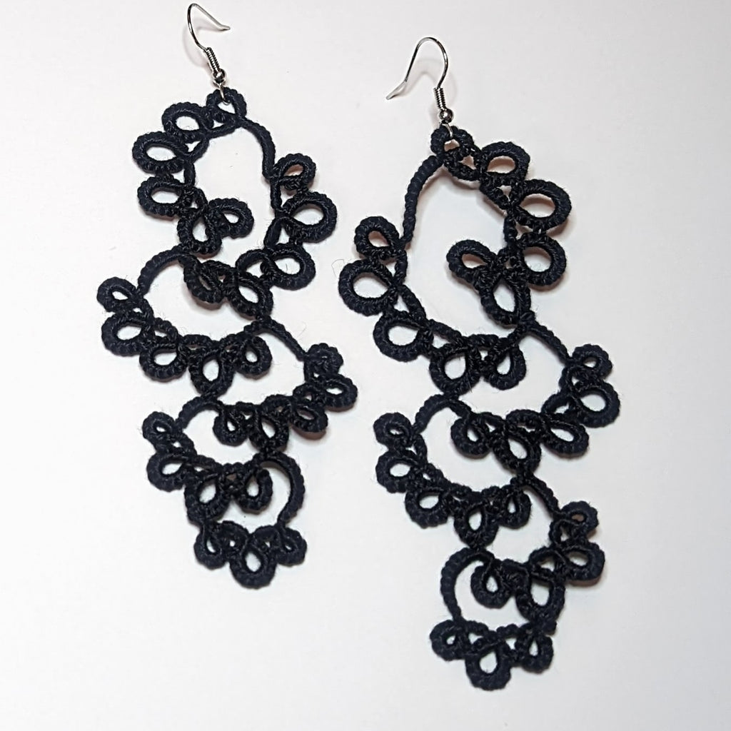 Black Drifting Bubbles Earrings on white background