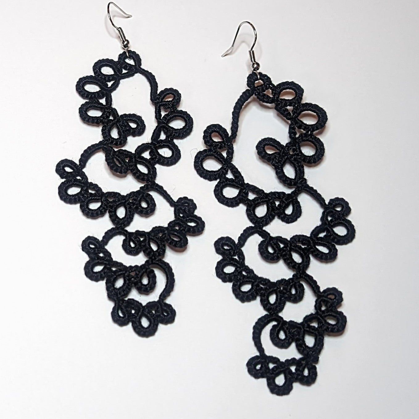 Black Drifting Bubbles Earrings on white background