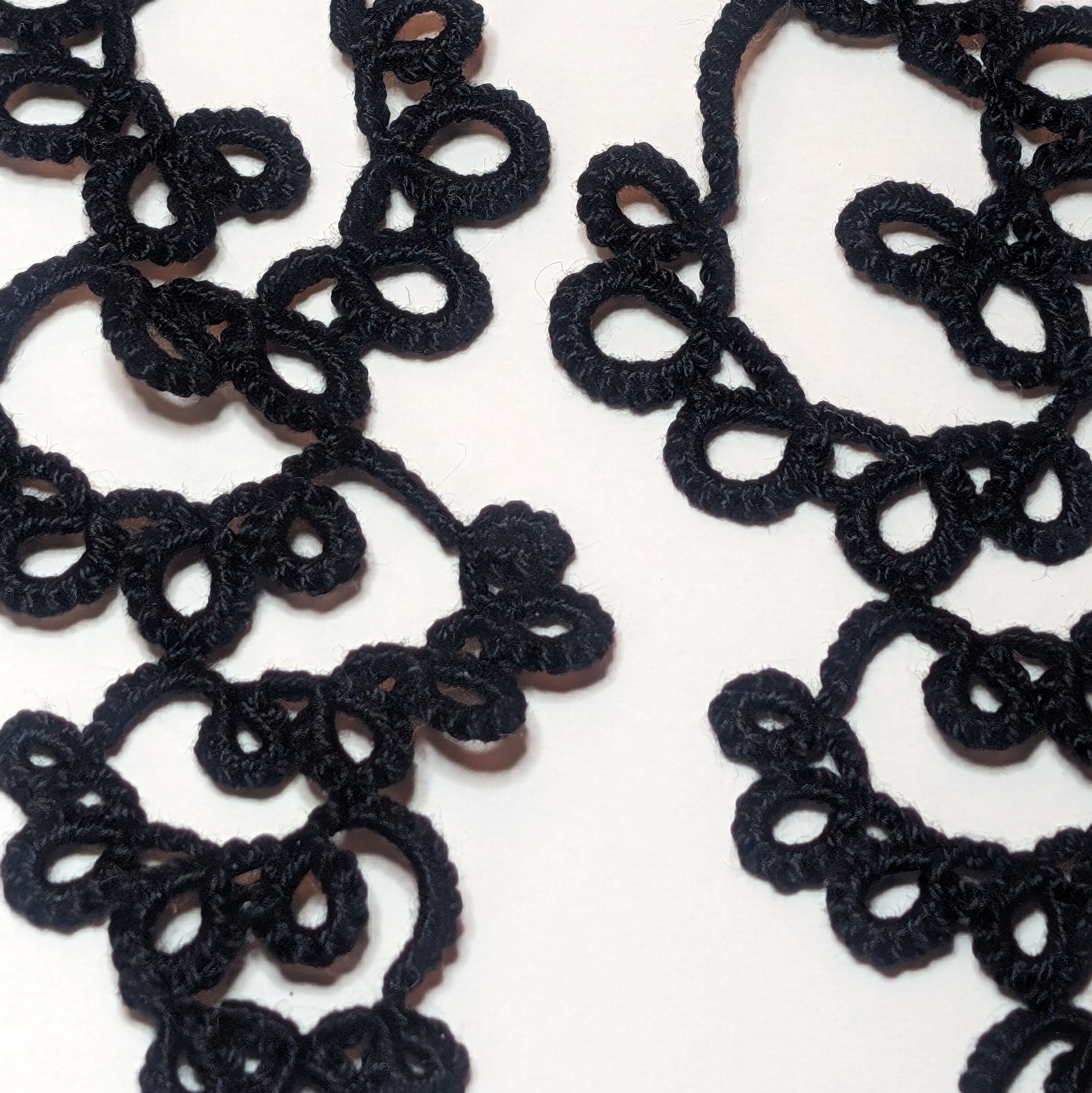 Black Drifting Bubbles Earrings Closeup on white background