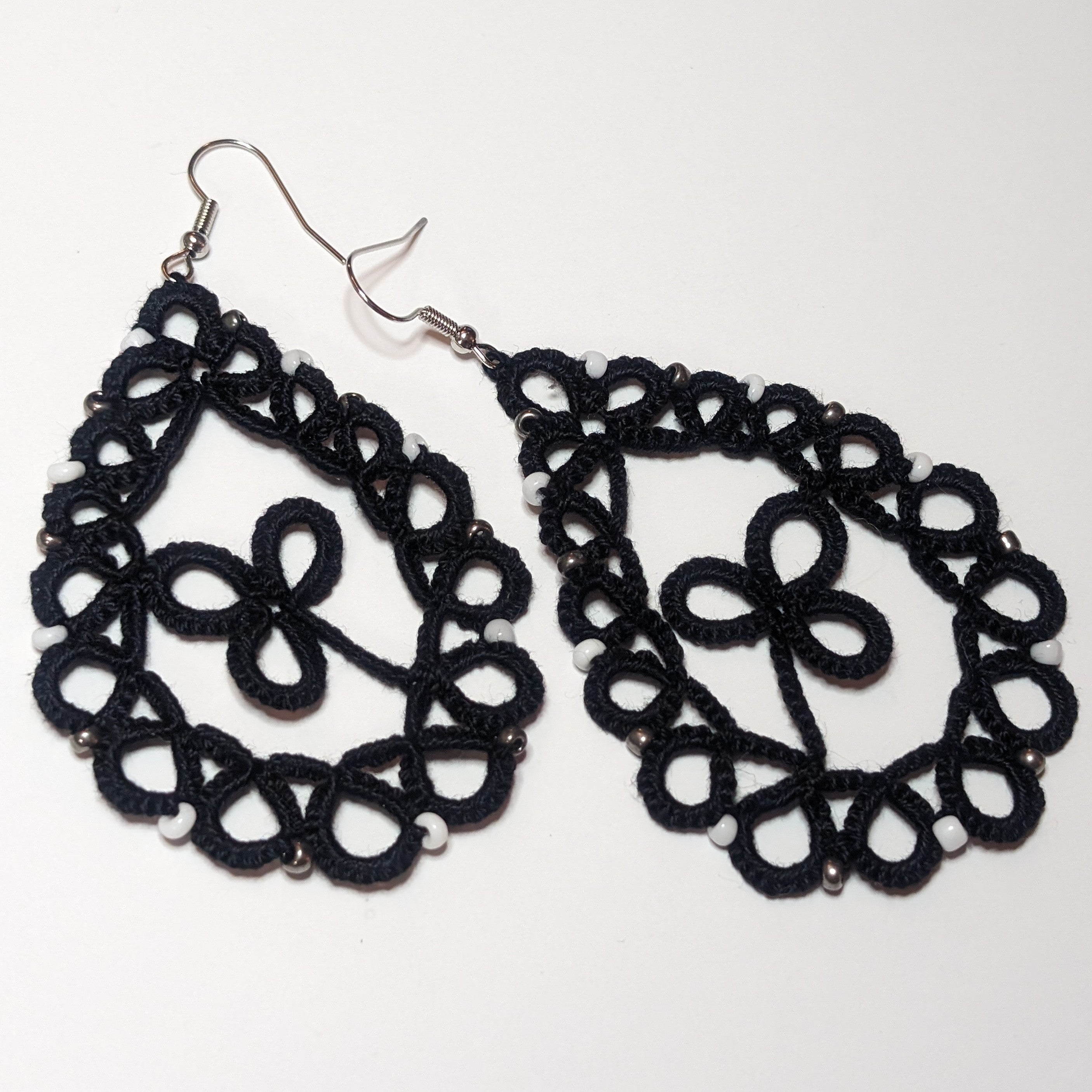 Black White Silver Clover Drop Earrings on white background