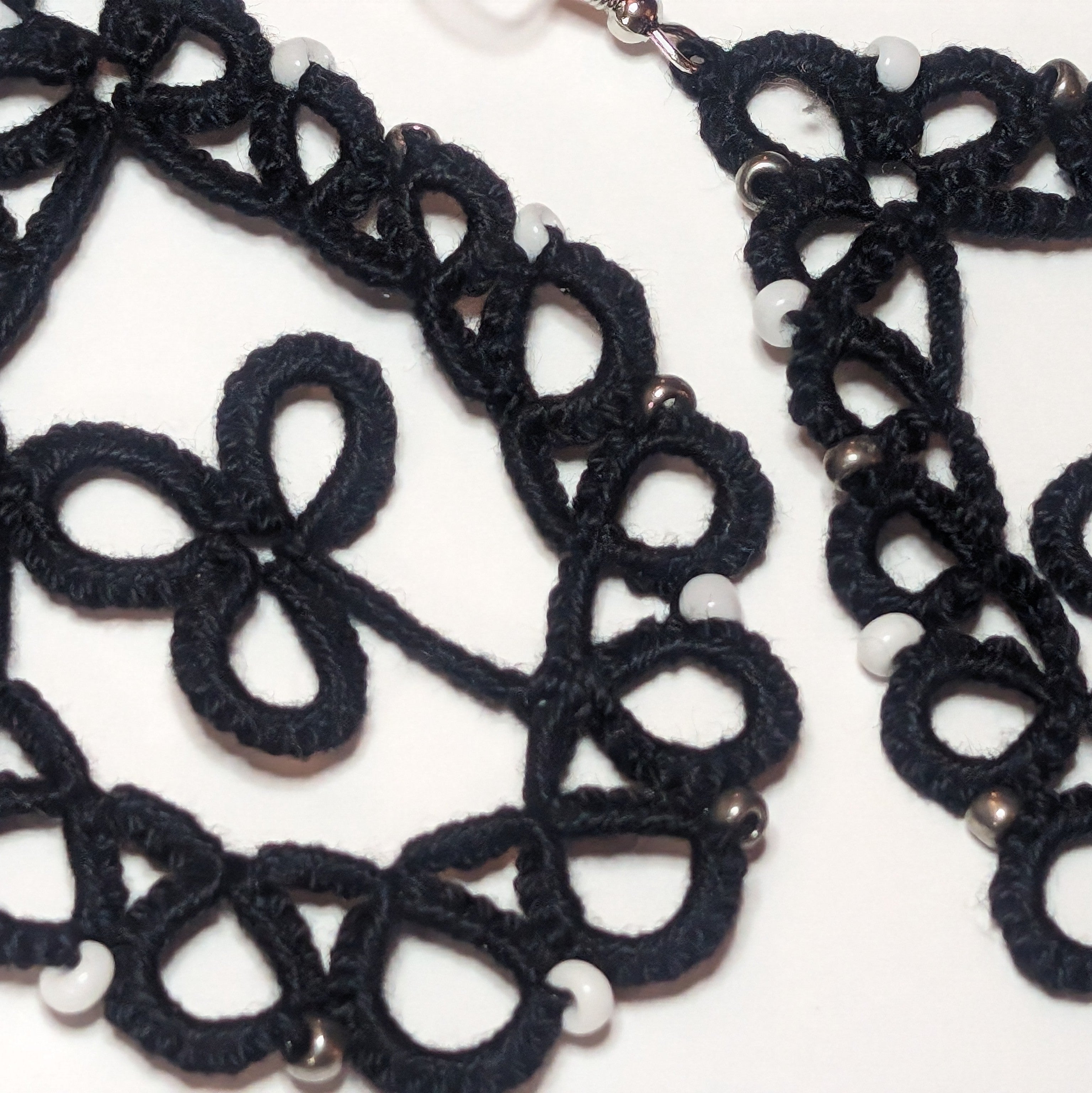 Black White Silver Clover Drop Earrings Closeup on white background