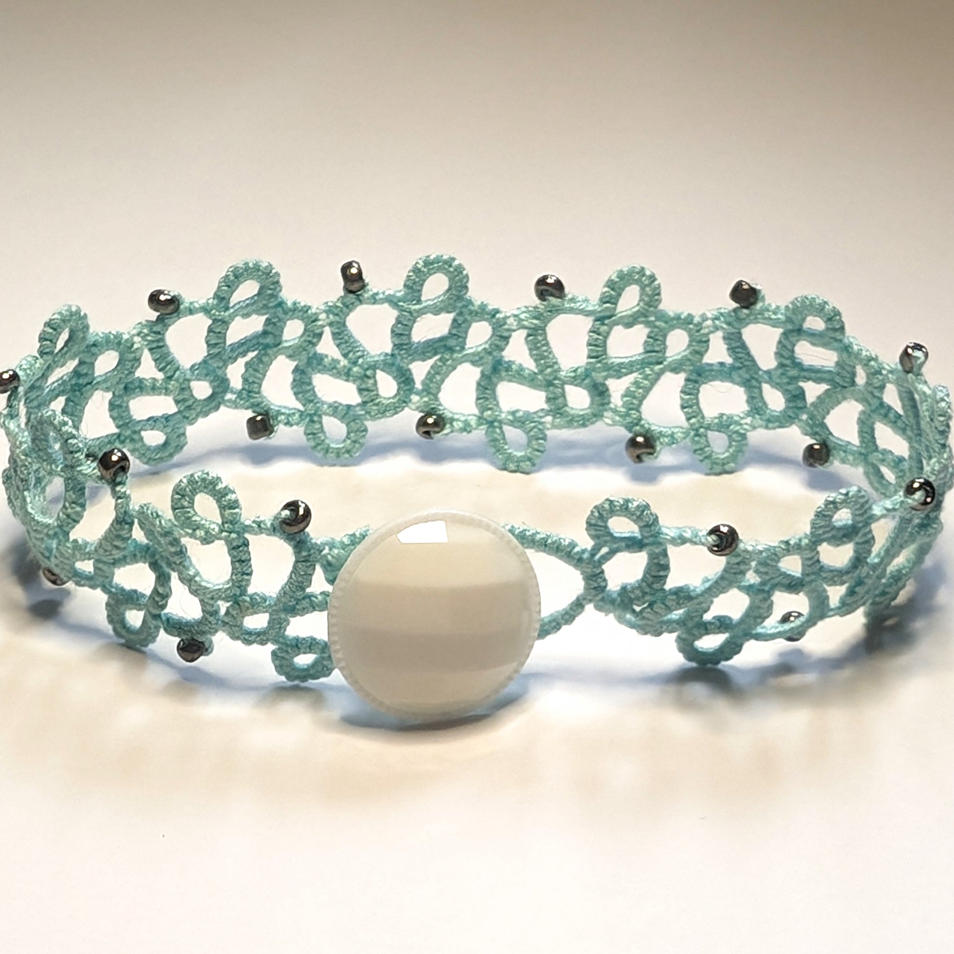 Icy Mint Metallic Silver White Button Modern Filigree Bracelet on White Background