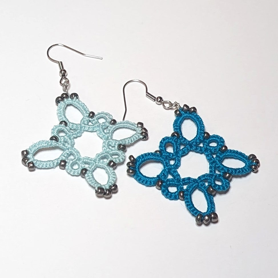 Icy Mint Teal Silver Starburst Earrings on white background