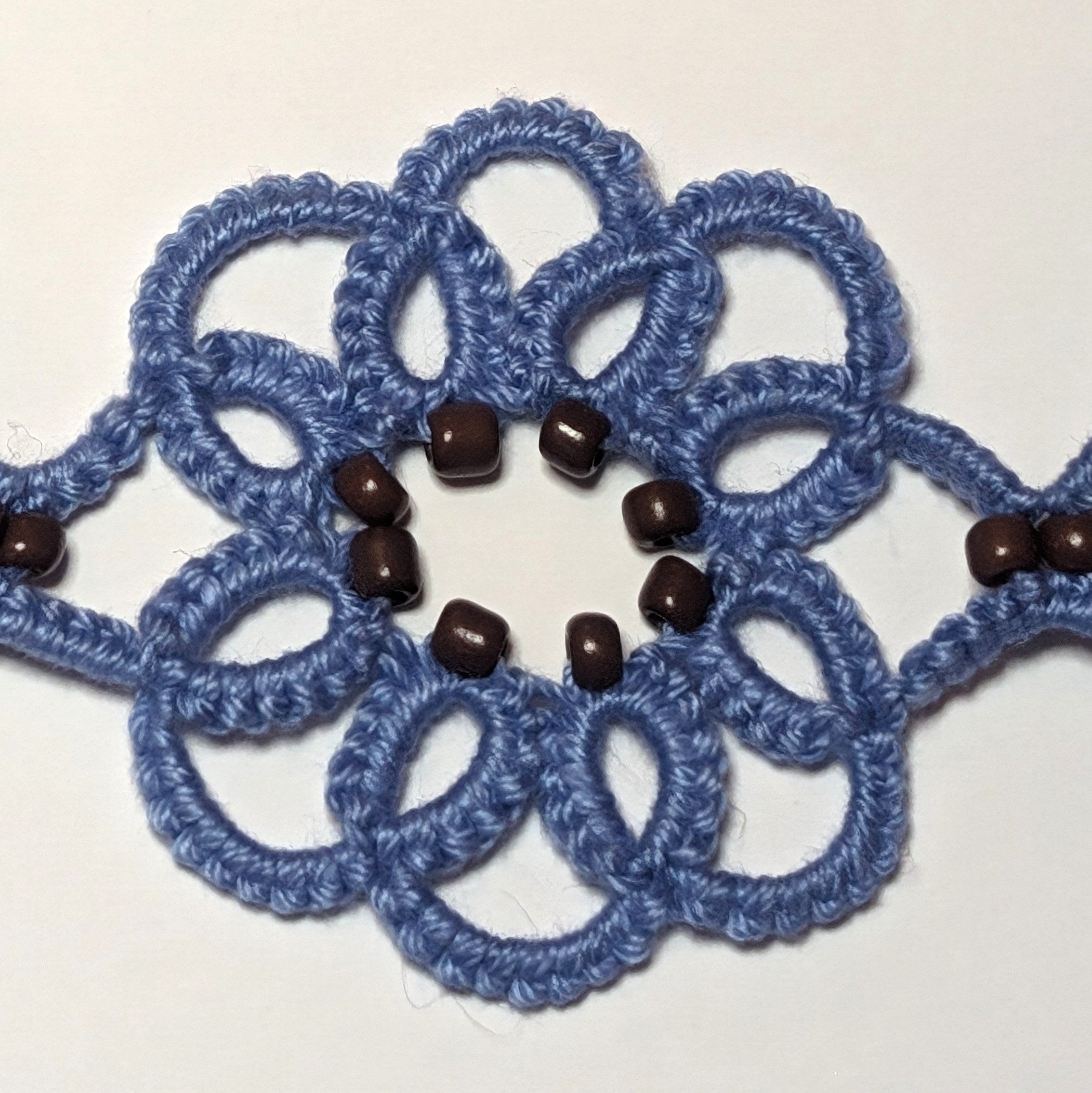 Light Blue Brown Clematis Bracelet closeup on white background