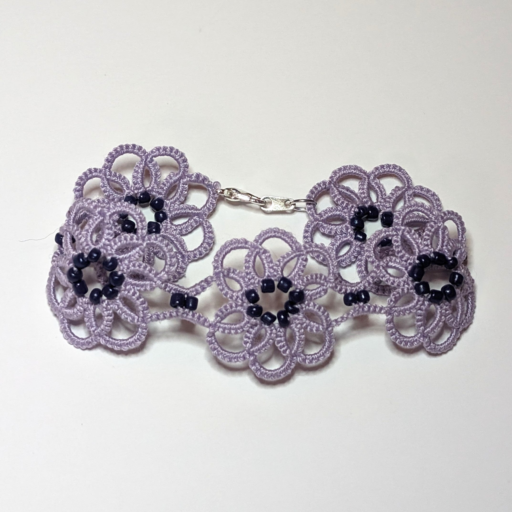 Lilac Dark Purple Clematis Bracelet on white background