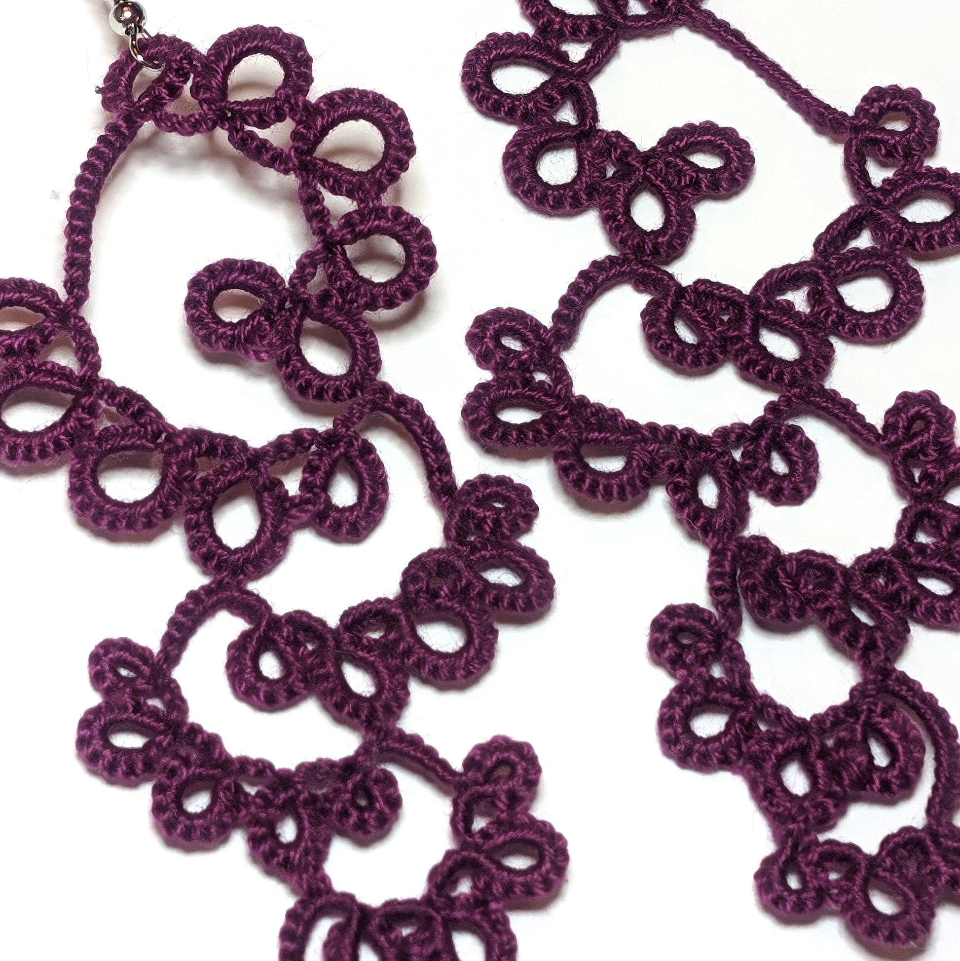 Plum Drifting Bubbles Earrings closeup on white background