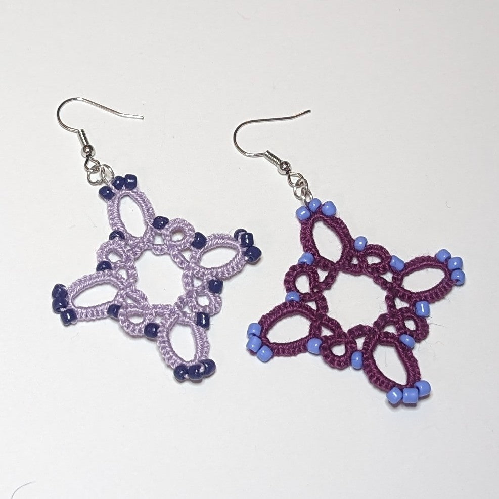 Shades of Purples Starburst Earrings Closeup on White Background