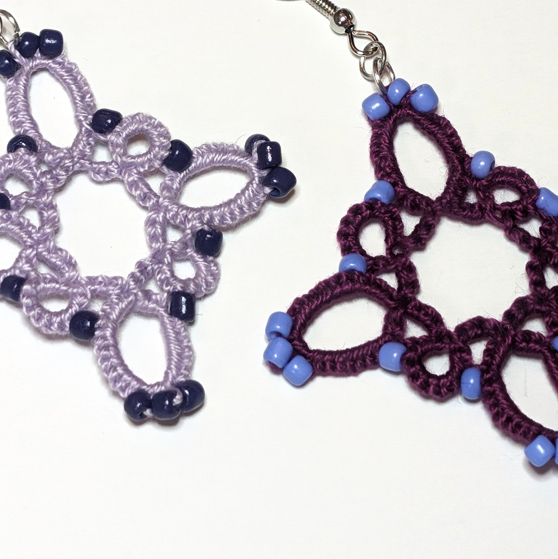 Shades of Purples Starburst Earrings Closeup on White Background